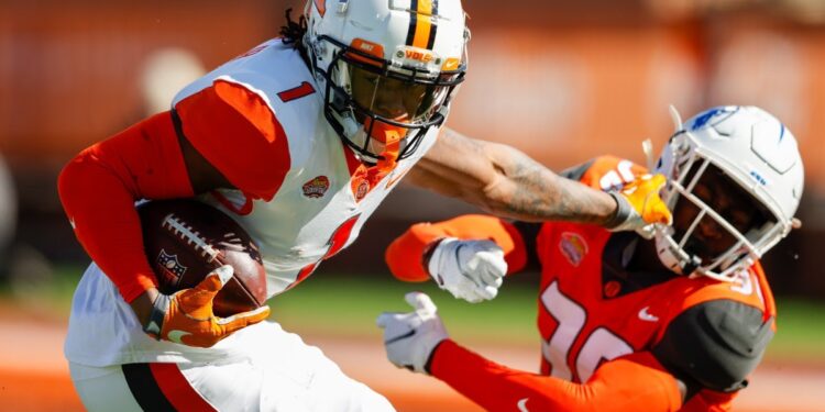 PM Terrance Drew congratulates Joshua Williams on playing match in NFL Super Bowl 57