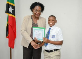 Denzil Douglas greets 13 students for receiving Susanna Lee High School Scholarship Awards