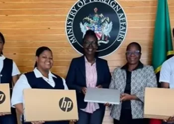 St Kitts and Nevis HC Kevin Isaac donates laptops to CFBC students