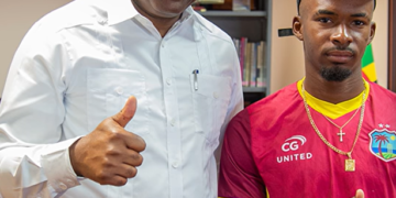 PM Roosevelt Skerrit greets Alick Athanaze on his selection to West Indies test side 